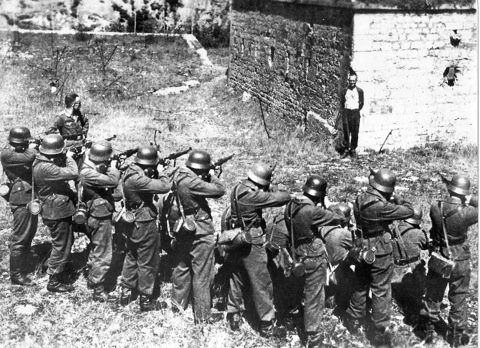 guy+smiling+at+firing+squad